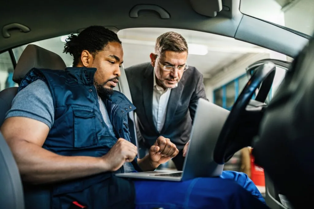 Certified inspector verifying VIN number during vehicle identity inspection